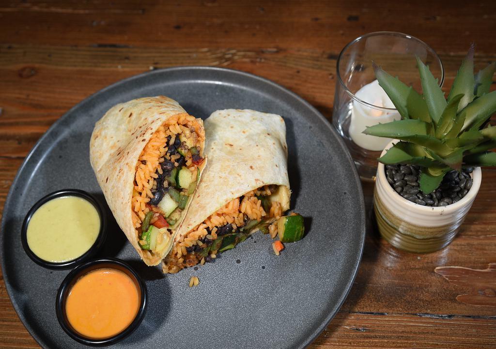 Vegetariano Burrito · Red and green peppers, red onions, rice, black beans, avocado, pico, crema and Oaxaca cheese.