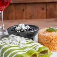 Enchilada · 3 chicken enchiladas in corn tortillas smothered in your choice of red creamy chili sauce, v...