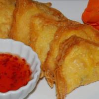 Crab Rangoon · Homemade crispy wonton filled with scallions, crabmeat, mixed vegetables and cream cheese.