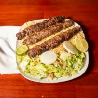 Kofta Kebab · Stick of small chunks of beef and onions grilled served with vegetables over rice.