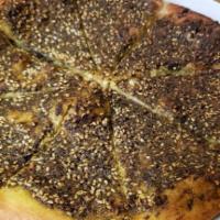 Za'Atar Mana'Eesh · Traditional Syrian mix for thyme, sesame seeds and zesty somak with extra virgin olive oil.