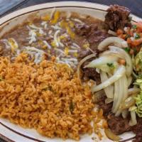Carne Asada · Tender sliced beef marinated in spices and charbroiled. Topped with grilled onions and serve...