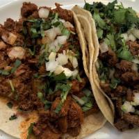 Pedro'S Tacos · Grilled steak, garnished with chopped onions, cilantro, and lime.