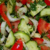 House Salad · Tomatoes, cucumbers, green peppers, onions, parsley, house dressing