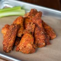 Smoked & Fried Chicken Wings · Rubbed and smoked for two hours, fried and reseasoned. Served with Alabama white sauce and c...
