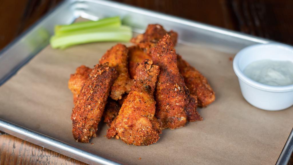 Smoked & Fried Chicken Wings · Rubbed and smoked for two hours, fried and reseasoned. Served with Alabama white sauce and celery.