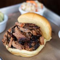Chopped Angus Brisket Sandwich · Smoked aged Angus brisket, rubbed with salt and pepper. True Texas style. All sandwiches com...