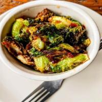 Fried Brussels Sprouts With Honey Sambal Sauce · Flash fried brussel sprouts dressed with a honey sambal sauce.