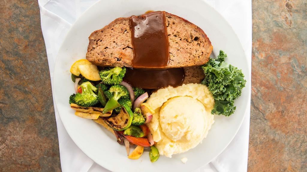 Baked Meatloaf · Baked homemade meatloaf with mashed potatoes and vegetable of the day