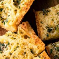 Garlic Bread · Roasted garlic, olive oil, parmesan cheese and a touch of oregano.