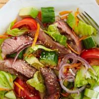 Steak Tip Salad · Mouth watering marinated sirloin tips on a house salad.