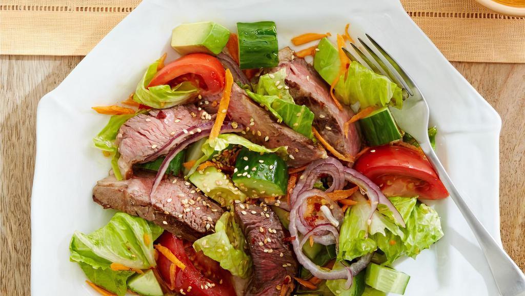 Steak Tip Salad · Mouth watering marinated sirloin tips on a house salad.