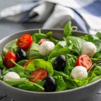 Mediterranean Salad · Salad with mixed greens, fresh mozzarella, roasted red pepper and tomato.