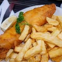 Fish & Chips · Haddock filet seasoned with homemade spices, lightly fried, served with French fries and col...