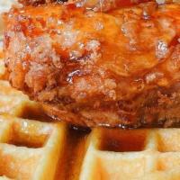 Chicken & Waffles · Crispy chicken & our homemade cornbread waffle drizzled with maple bourbon bacon syrup