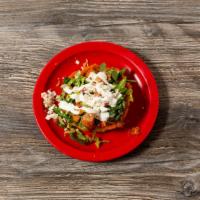 Sopes · Open face homemade corn tortillas, smothered with beans, and topped with the meat of your ch...