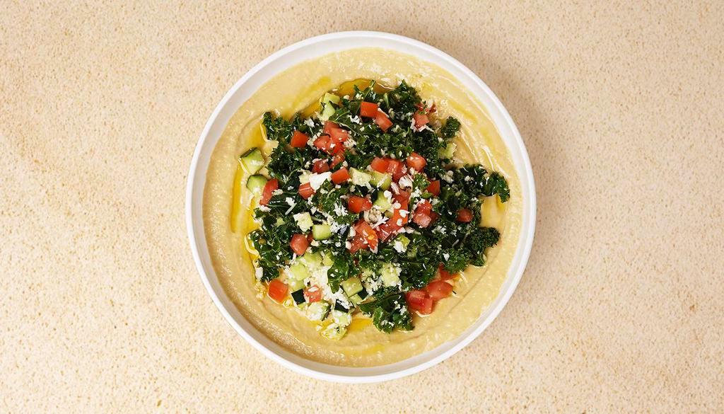 Tabbouleh Hummus · Hummus topped with tabbouleh. Served with pita.