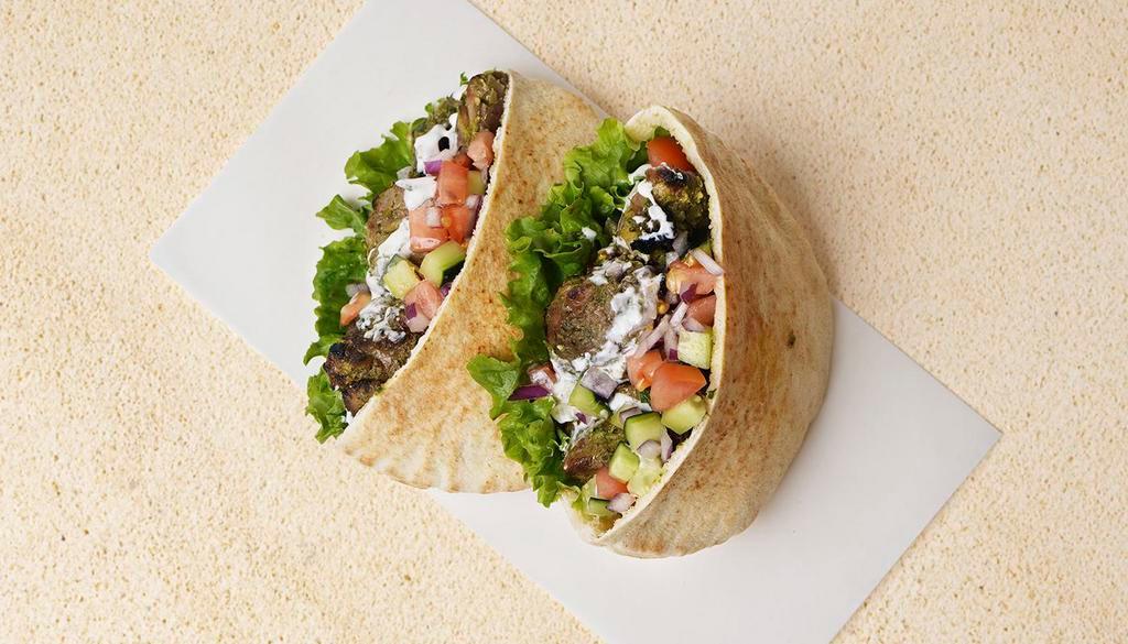 Koobideh Pita Sandwich · Wrapped in a pita with lettuce, cucumber, tomato, and your choice of sauce.