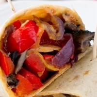 Roasted Veggie Wrap · Roasted bell peppers, garlic, caramelized onions and artichokes, Served with Hummus and pick...