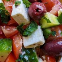 Greek* · Lettuce, tomatoes, onions, cucumbers, olives, topped with chunks of feta cheese. Served with...