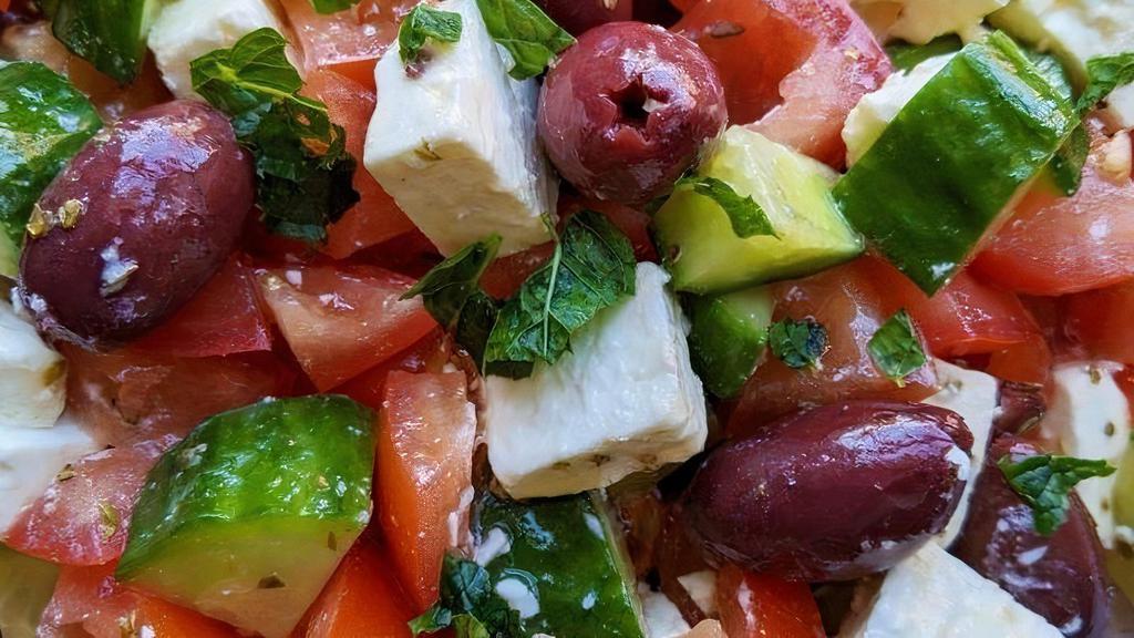 Greek* · Lettuce, tomatoes, onions, cucumbers, olives, topped with chunks of feta cheese. Served with our homemade vinegar dressing.