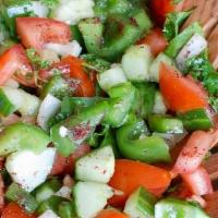 Lebanese* · Chopped cucumber, onion, tomatoes and fresh mint. Served with a sumac-vinegar dressing.