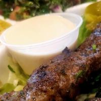 Kafta Kabob · 2 kebobs of mildly spiced ground beef and lamb (mixed with fine parsley and onions). Served ...