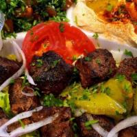 Lebanese Beef Kabob · 2 kebobs of juicy beef chunks, marinated with Lebanese spices. Served with sesame tahini sau...