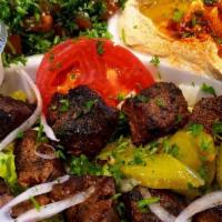 Ginger Beef Kabob · 2 kebobs of juicy beef chunks, marinated in a spicy ginger sauce. Served with sesame tahini ...