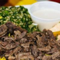 Beef Shawarma Platter · Traditional flavorful marinated beef, cut into strips and served with sesame tahini paste an...