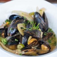 Sherry Infused Mussels · Shaved fennel, roasted garlic and saffron butter sauce 11