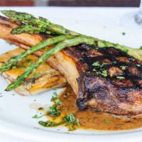 Veal Chop · 20 oz grilled veal chop served over a layered potato cake with a wild mushroom peppercorn sa...