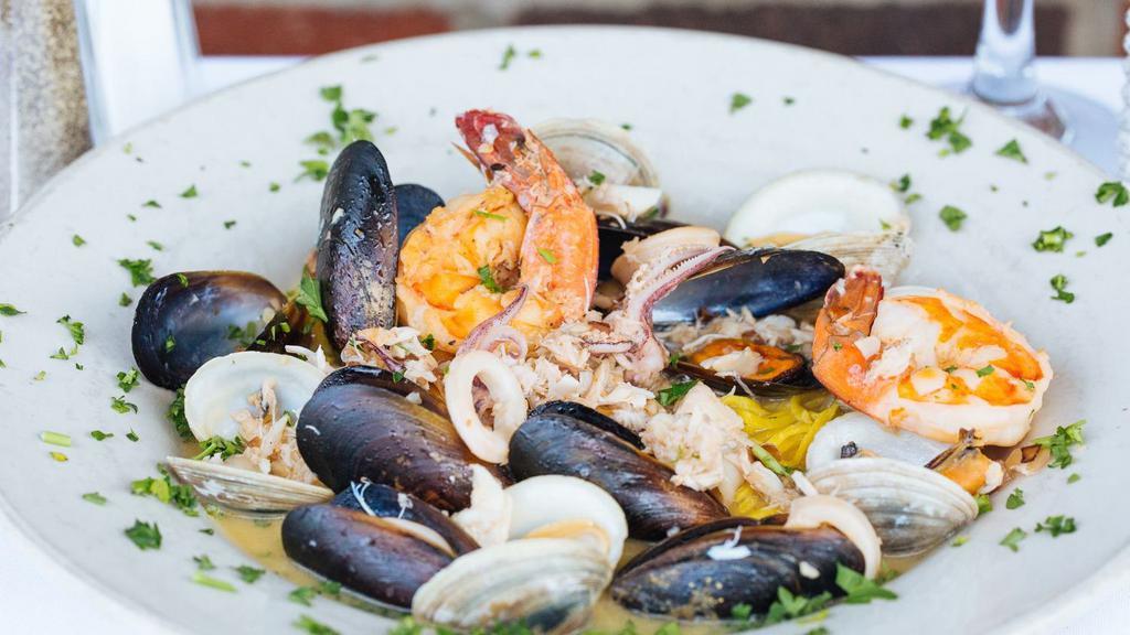 Pescatore · Mussels, clams, calamari, shrimp, and lump crab, red or white over homemade pasta.