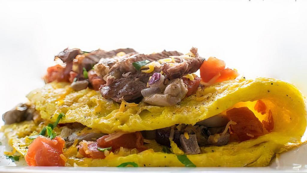 The Steak Omelette · Steak, Onion, Pepper, Tomatoes, Mushrooms, & Choice of Cheese