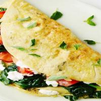 The Mediterranean Omelette · Tomatoes, Spinach, and Feta cheese.