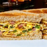 The Western Patty Sandwich · Eggs, peppers, onions, Ham, Cheese, and hash brown Patty on the sandwich.