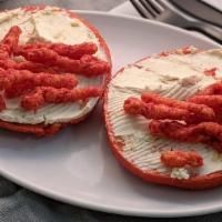 Flaming Hot Cheetos Overflow · Flaming hot cheetos bagel with cheddar habanero cream cheese and flaming hot cheetos in the ...