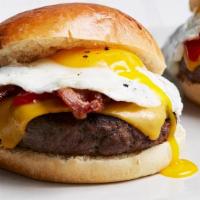 The Sunriser Burger W/Fries · Crisp bacon, American cheese and 1 egg over easy.