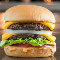 The Double Cheese W/Fries · Two pieces of 6oz patties, American cheese, lettuce and tomato.