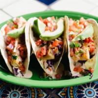 Grilled Baja Tacos · Perfectly grilled mahi dusted with a special blend of spices. Served in grilled flour tortil...