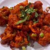 Chili Paneer · Deep fried battered Indian cheese cubes tossed with green chili.