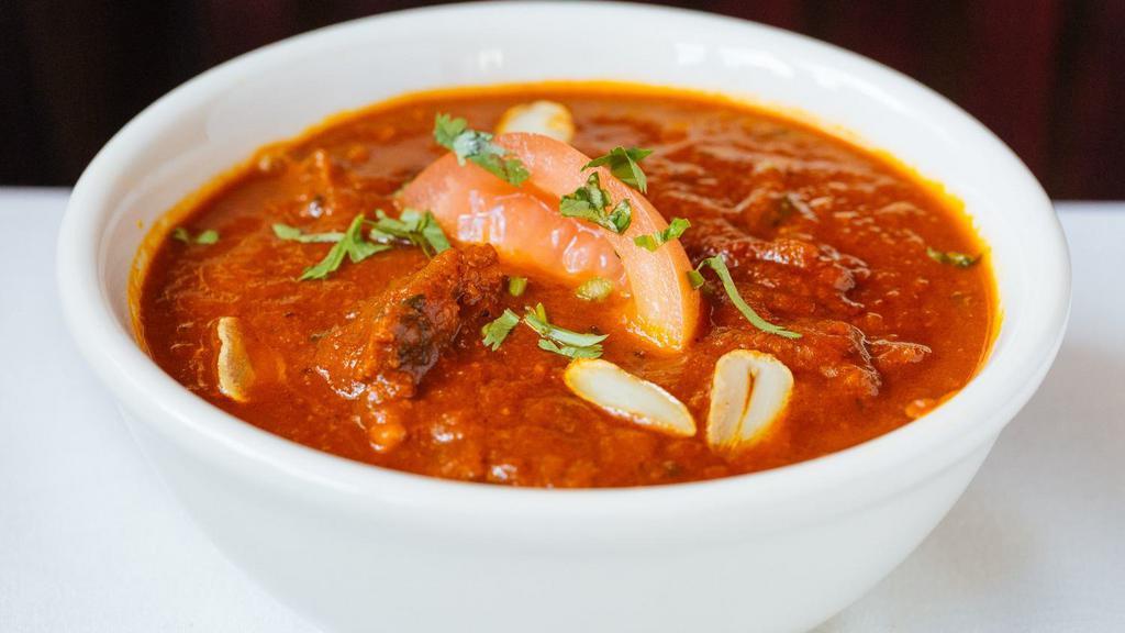 Lamb Curry · Tender lamb marinated and cooked in a curry sauce of fresh herbs and spice.