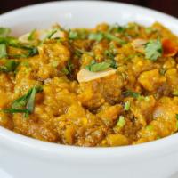 Navaratan Korma · A medley of nine vegetable cooked with mild creamy sauce topped with cashews and raisins.