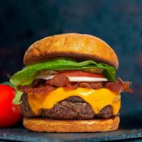 Bacon Burger · Beef patty, bacon, lettuce, tomato, onion, pickles, mayo, and melted american cheese on a wa...