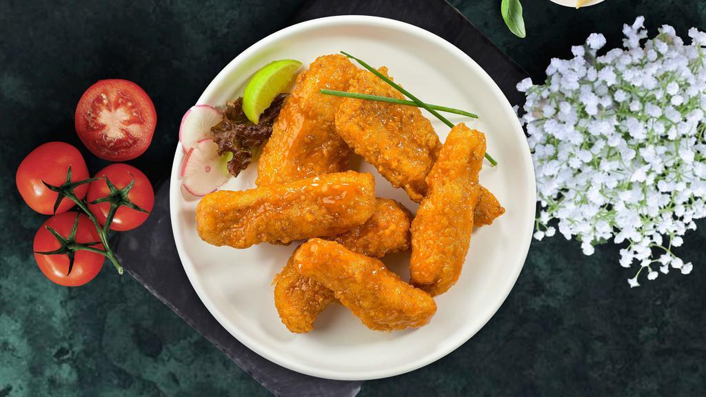 Buffalo Chicken Tenders · Chicken tenders cooked crispy and tossed in our buffalo wing sauce. Served with Blue Cheese.