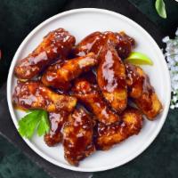 Bbq Chicken Wings · Wings cooked and tossed in classic BBQ Sauce. Served with Ranch Sauce.