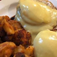 Eggs Benedict · 2 poached eggs on Canadian bacon , English muffin and topped w/hollandaise sauce