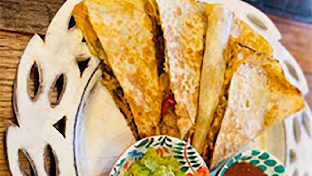 Super Quesadilla · 12-inch flour tortilla with Mexican cheese + Protein choice + any hot toppings.  Served with 2 sides.