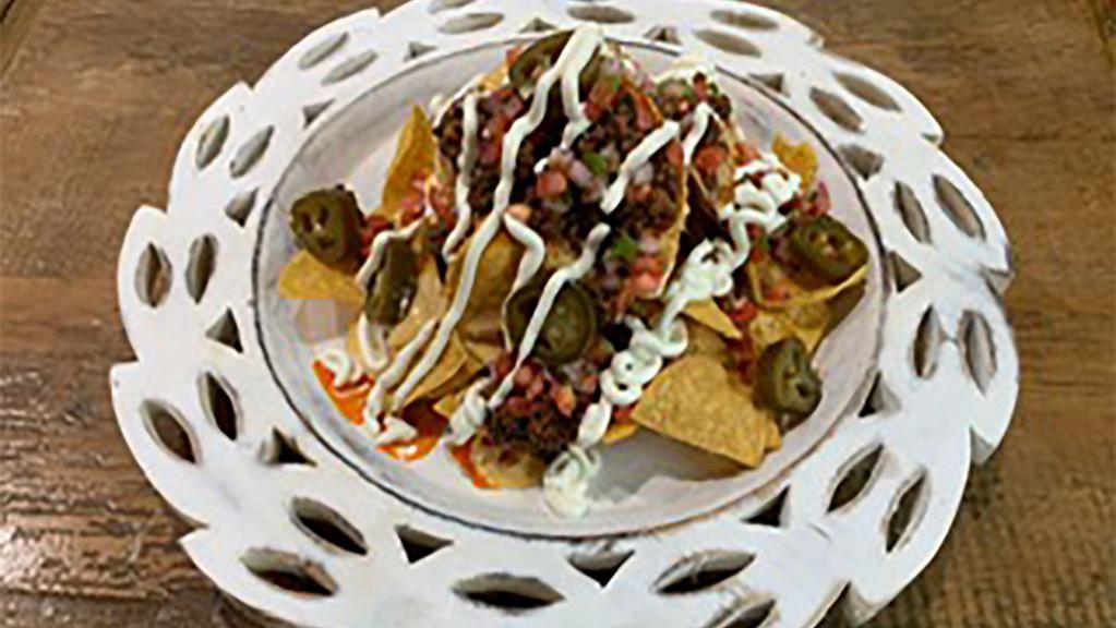 Nachos (Meat+Jalapenos+Pico+Sour Cream) · Corn Tortilla chips with queso +  protein of your choice + jalapenos + pico de galo + sour cream