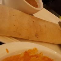 Chicken Masala Dosa · A thin crispy crepe stuffed with barbequed chicken and spiced mashed potatoes, made over a s...